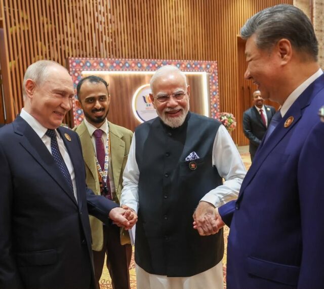Modi, Putin, Xi hand-in-hand