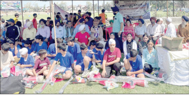 Sports kits distributed among hockey players in Srinagar
